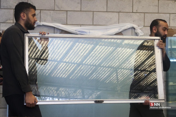 کارگاه مردمی جهادی شیشه بری در ساختمان‌های آسیب دیده