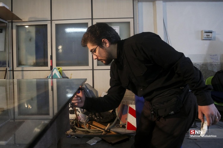 کارگاه مردمی جهادی شیشه بری در ساختمان‌های آسیب دیده
